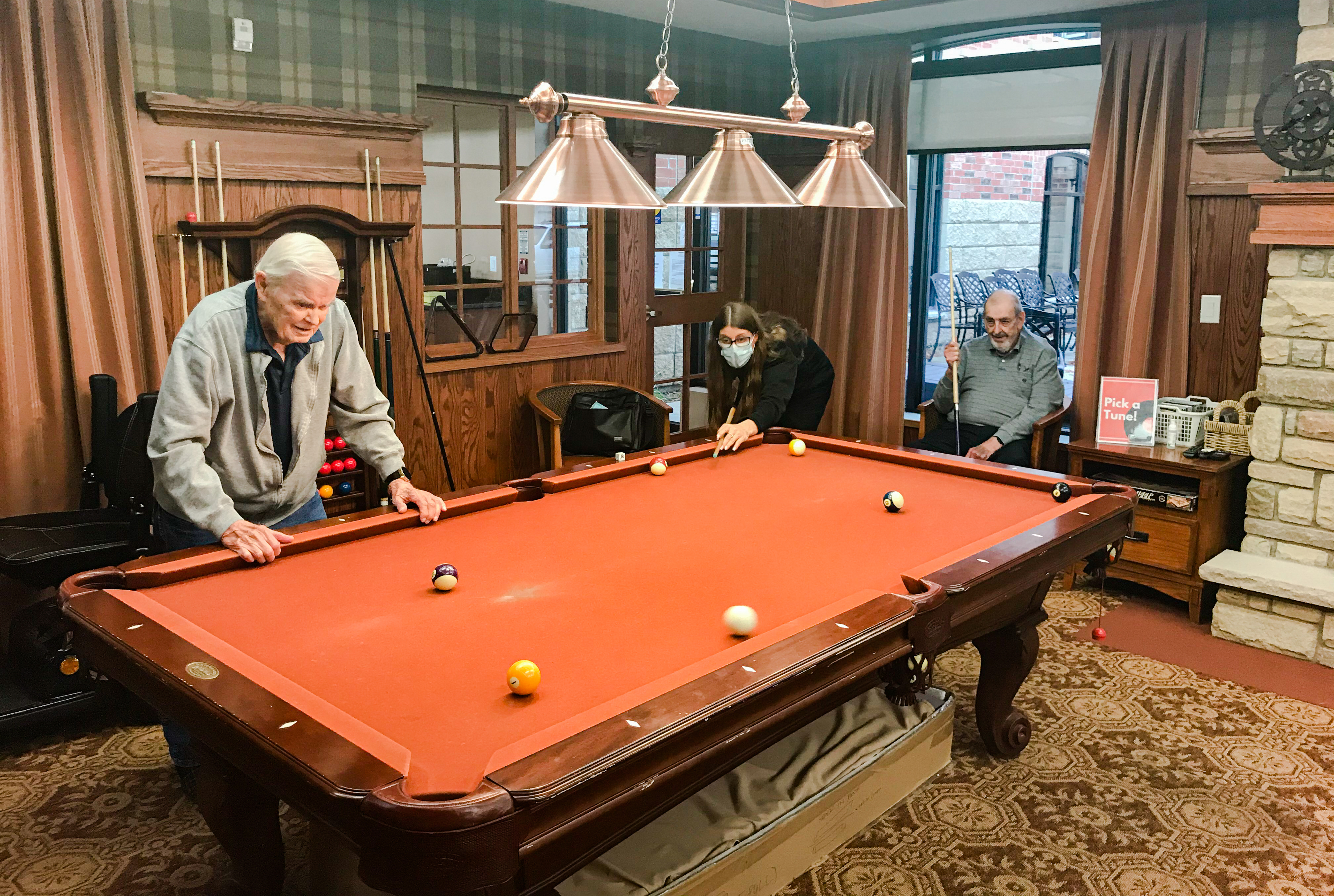 Roy offers Amber some pointers as Peter watches on.