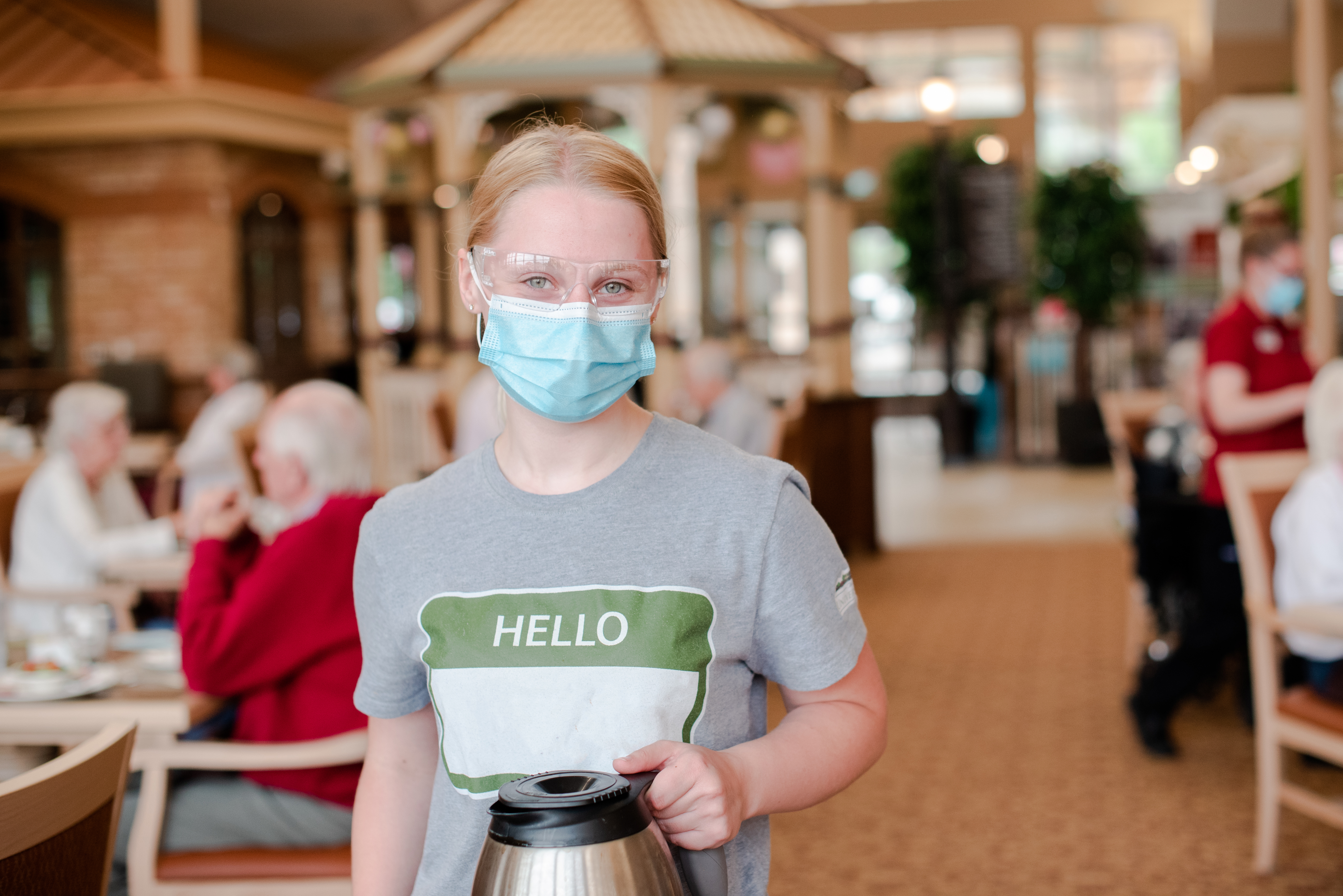 Team member with coffee pot in the Main Dining Room 