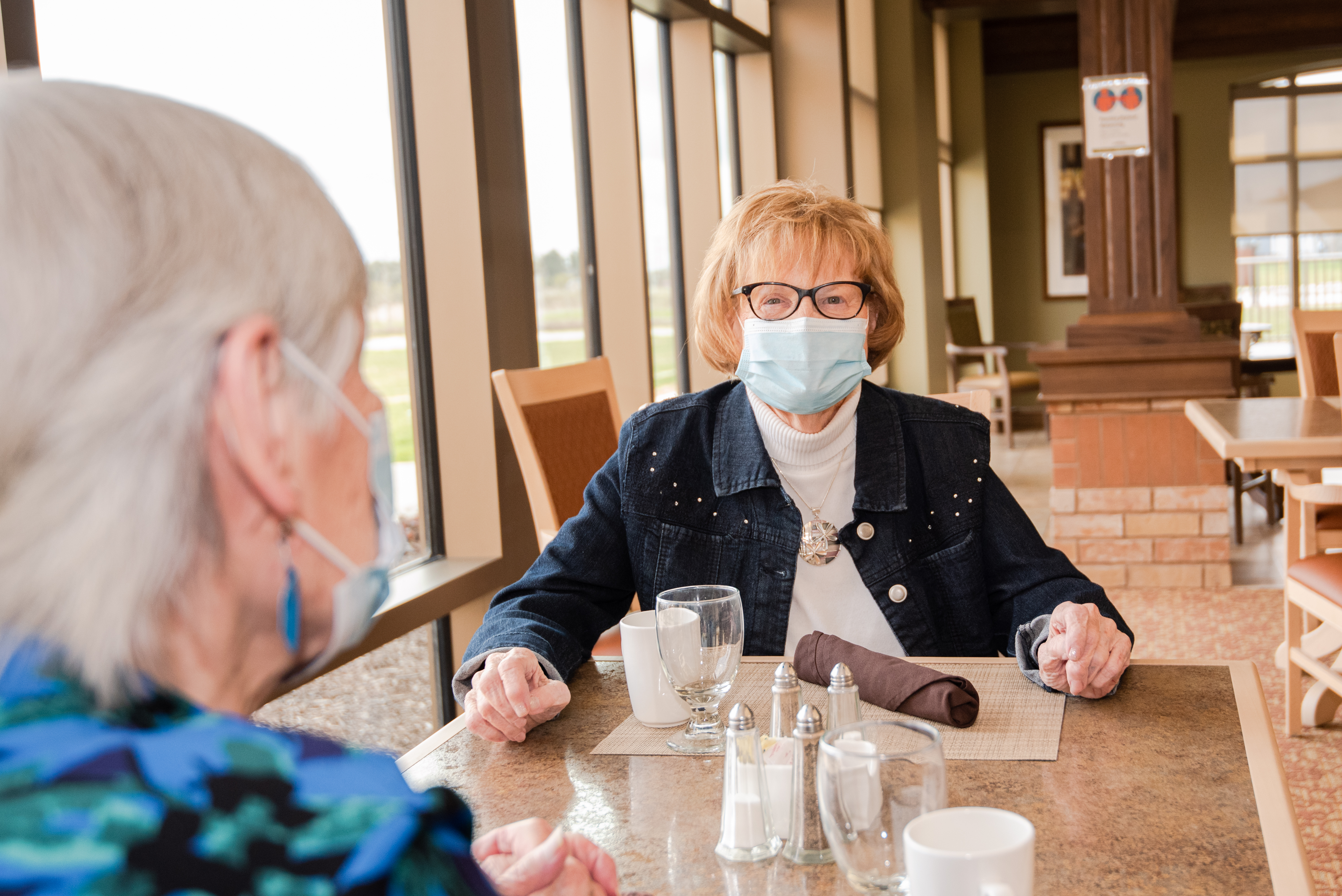 Residents socialize in at the dining table