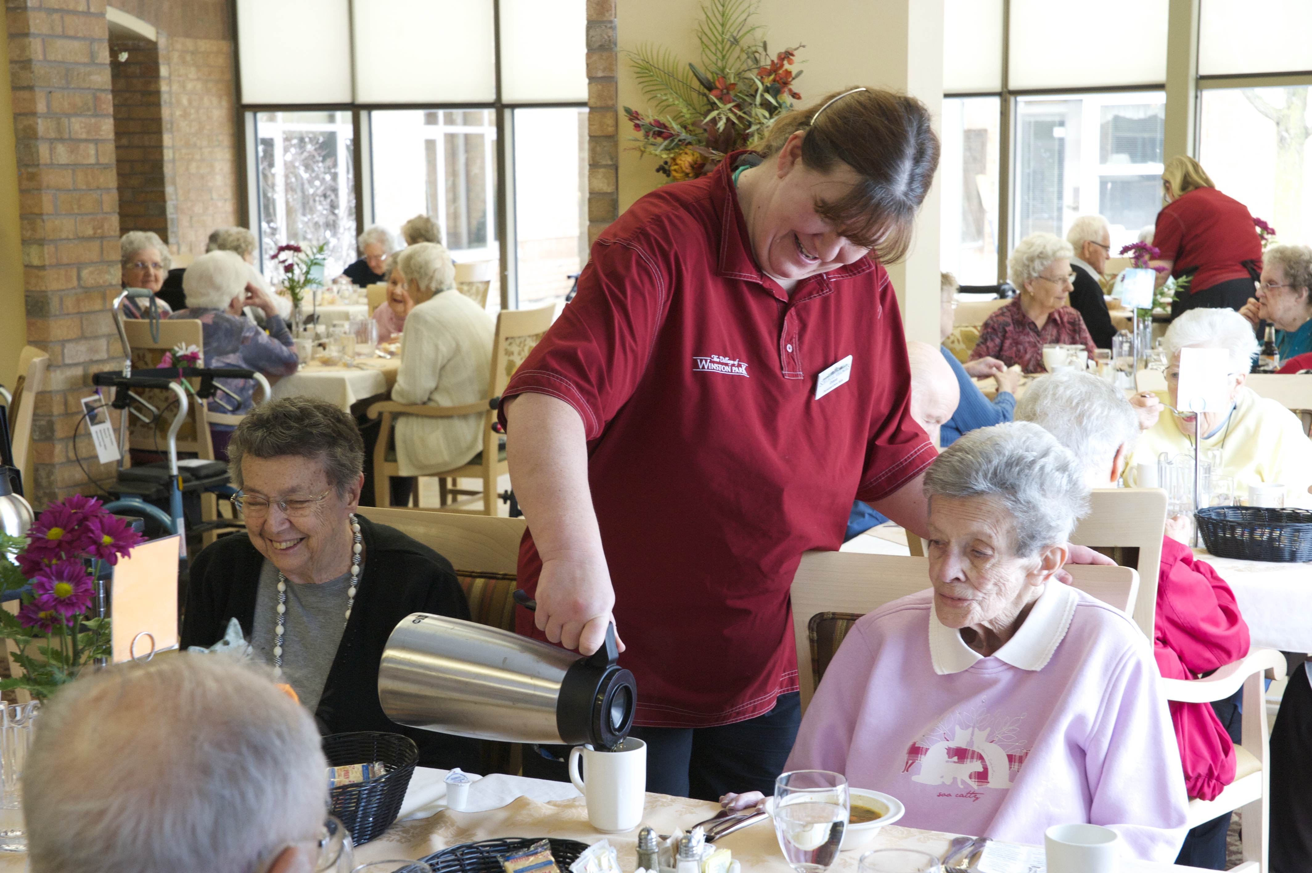 Team member serving coffee in the Main Dining Room 