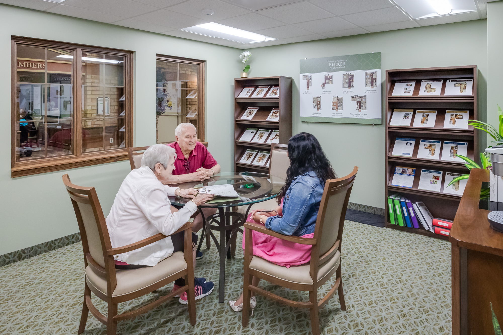 Seniors meeting with our Director of Lifestyle Options learning about the Village at University Gates