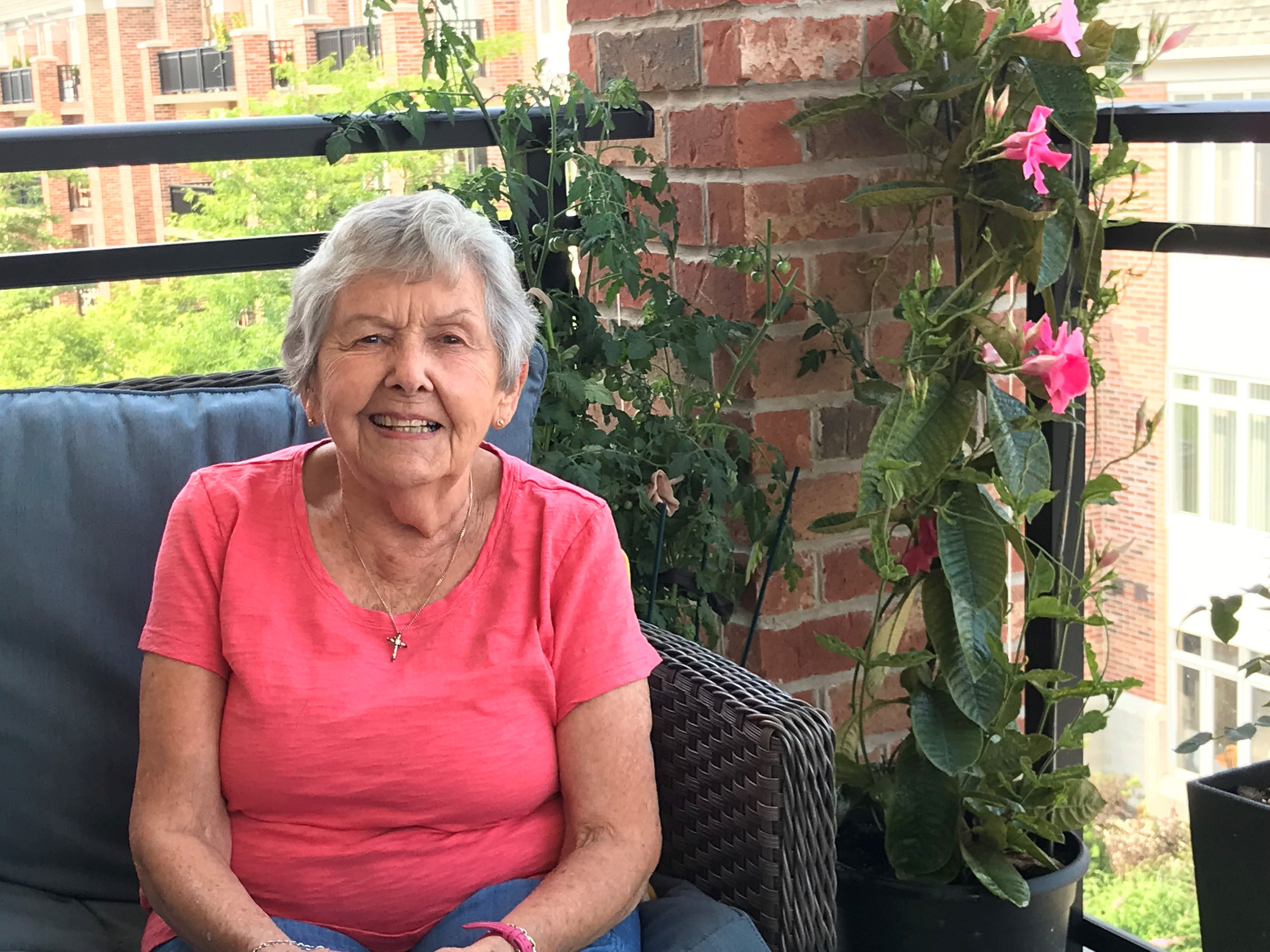 Rita Munro upon her balcony at Ailsa Craig in The Village of Arbour Trails in Guelph.