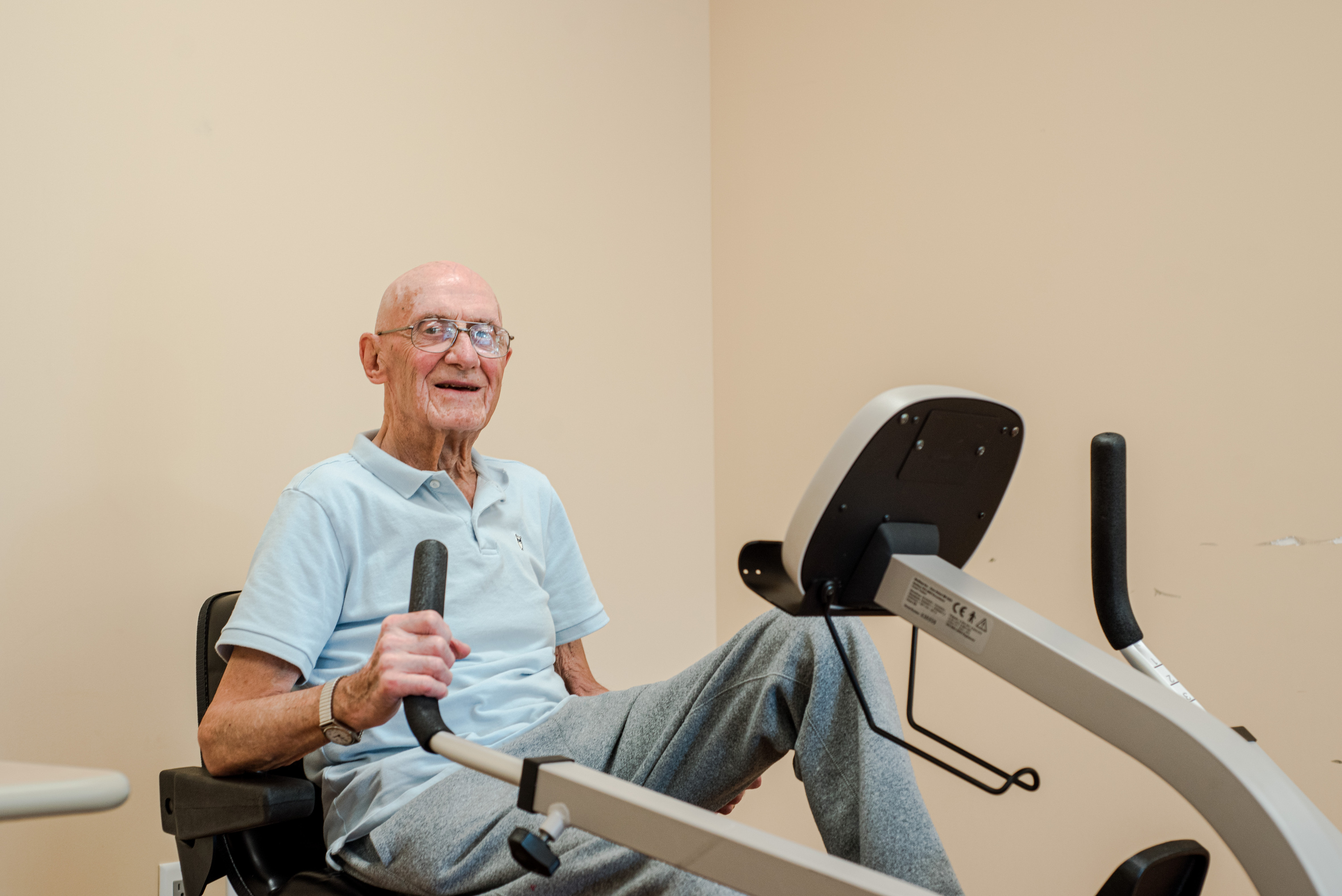 Resident on recumbent bike