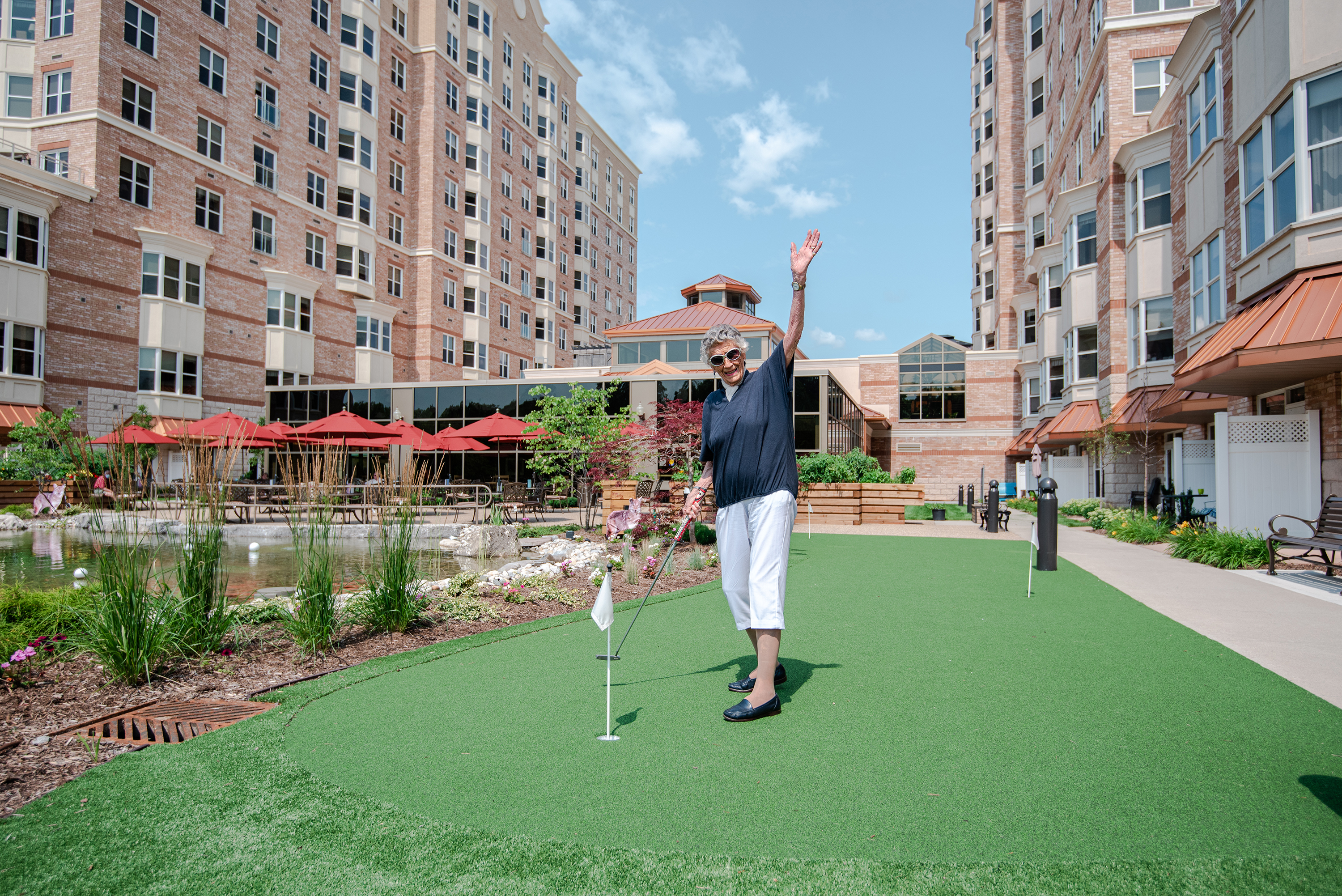 Resident putting in the Village Courtyard