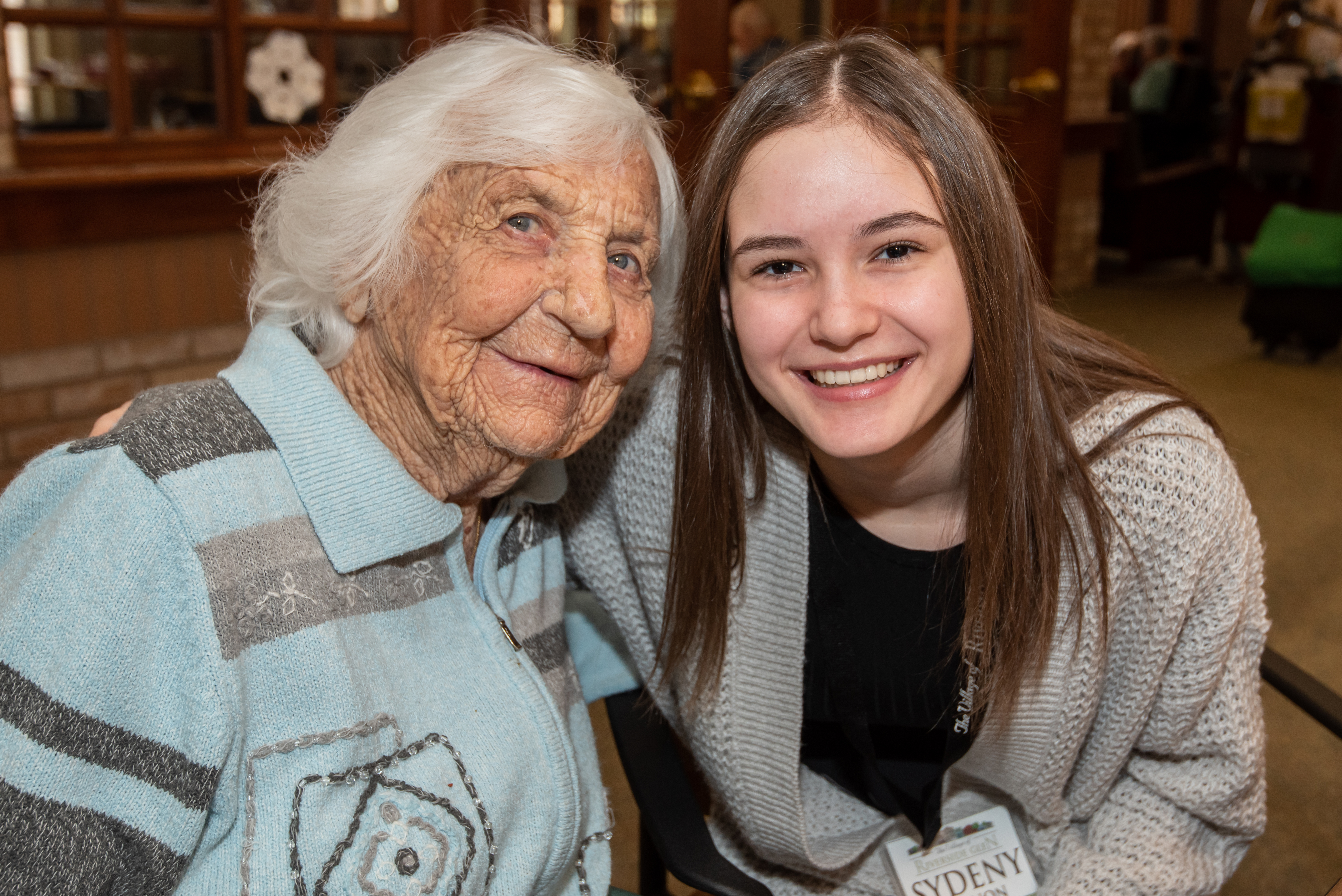 Resident and volunteer smiling for the camera