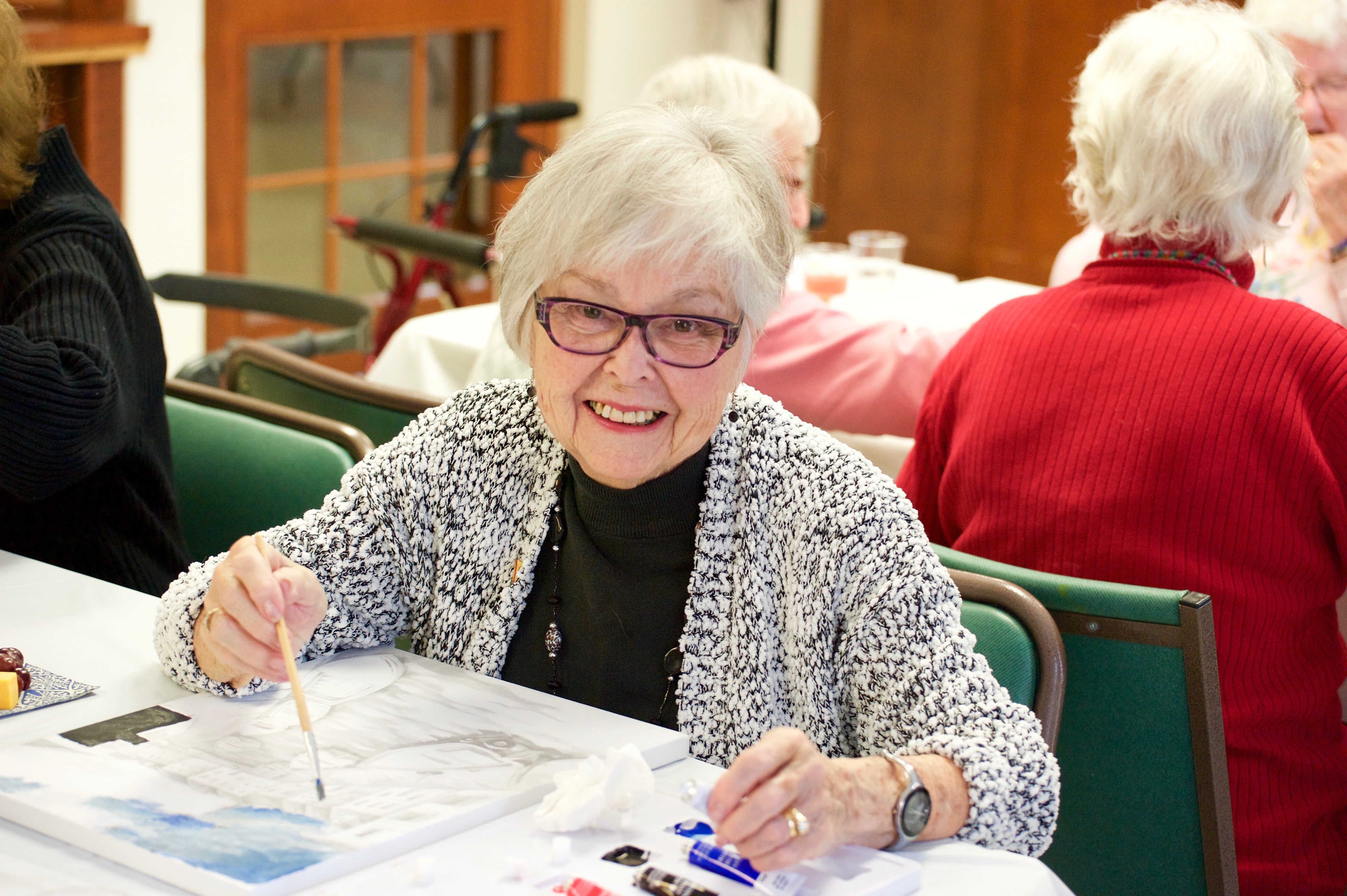 Resident enjoying a painting class