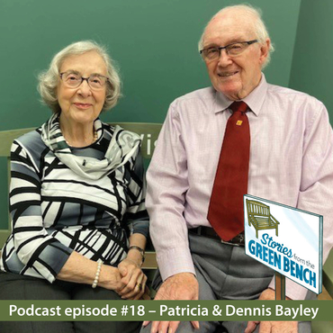 Patricia and Dennis sitting on the green #ElderWisdom bench at The Village of Taunton Mills