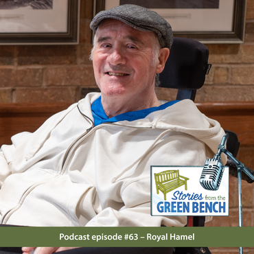 Royal Hamel sitting with the green #ElderWisdom bench