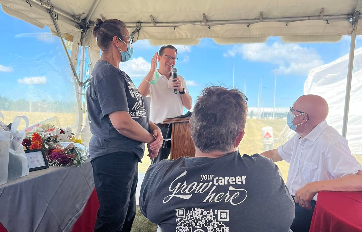 Jamie Schlegel addresses the group during the celebration of The Village of Sandalwood Park 20th anniversary.