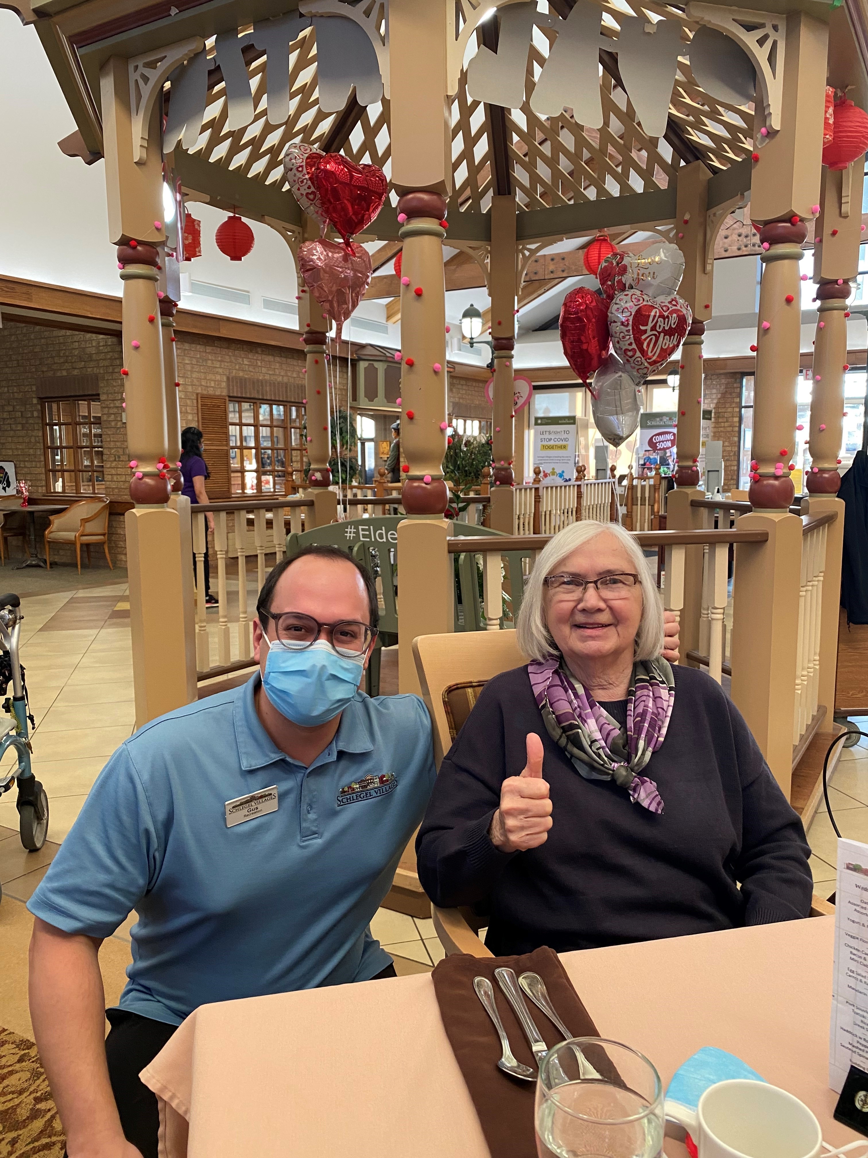 Gus receives a thumbs up from a resident at The Village of Winston Park