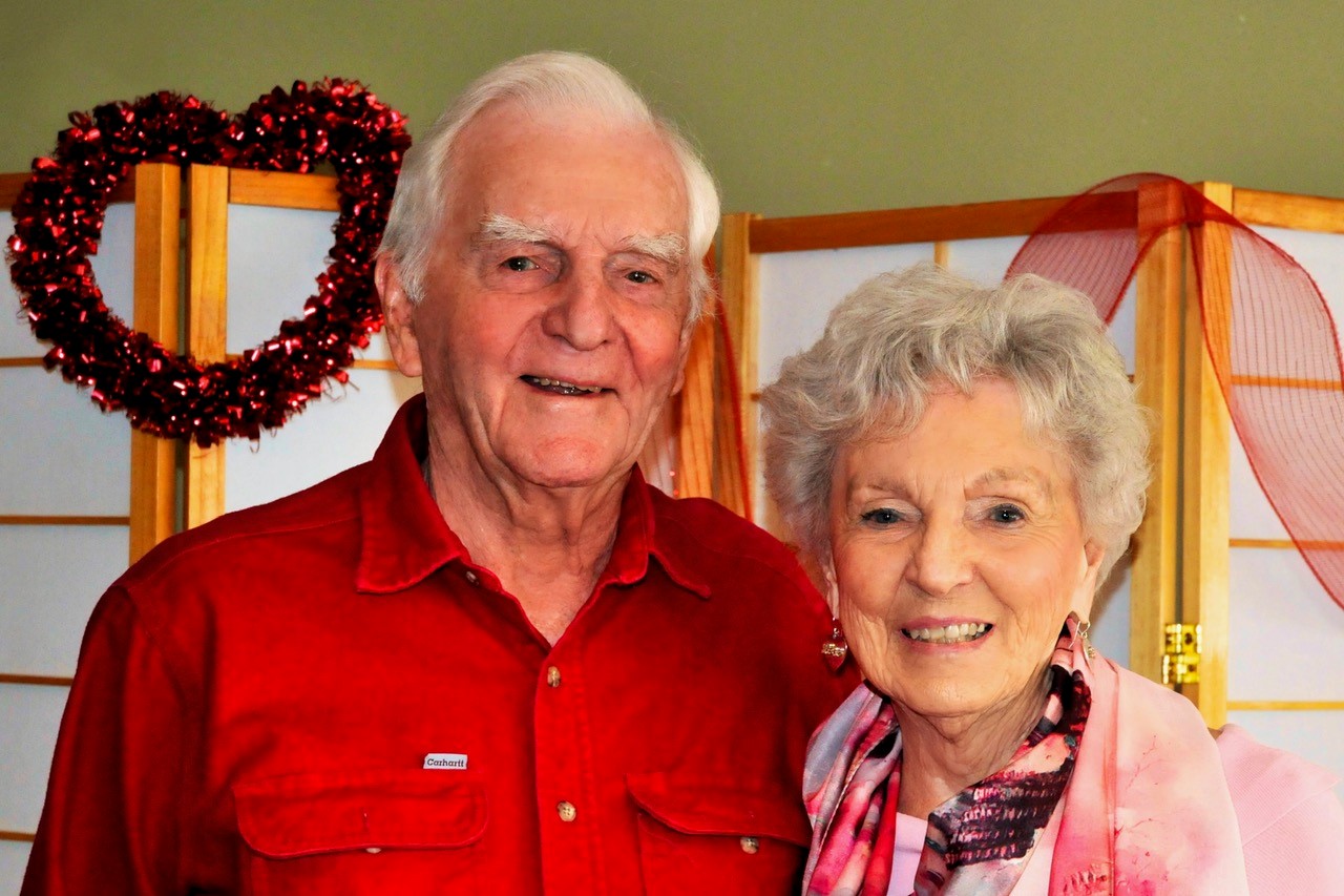 Bill and Helen stand together smiling! 