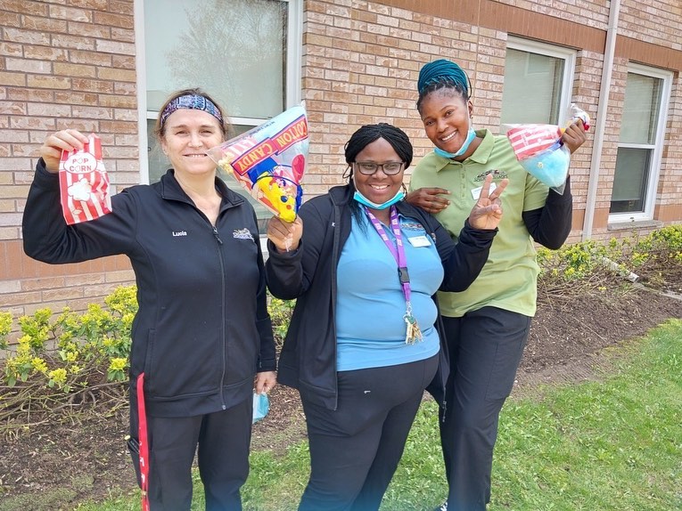 Three Riverside Glen team members smile for the camera.