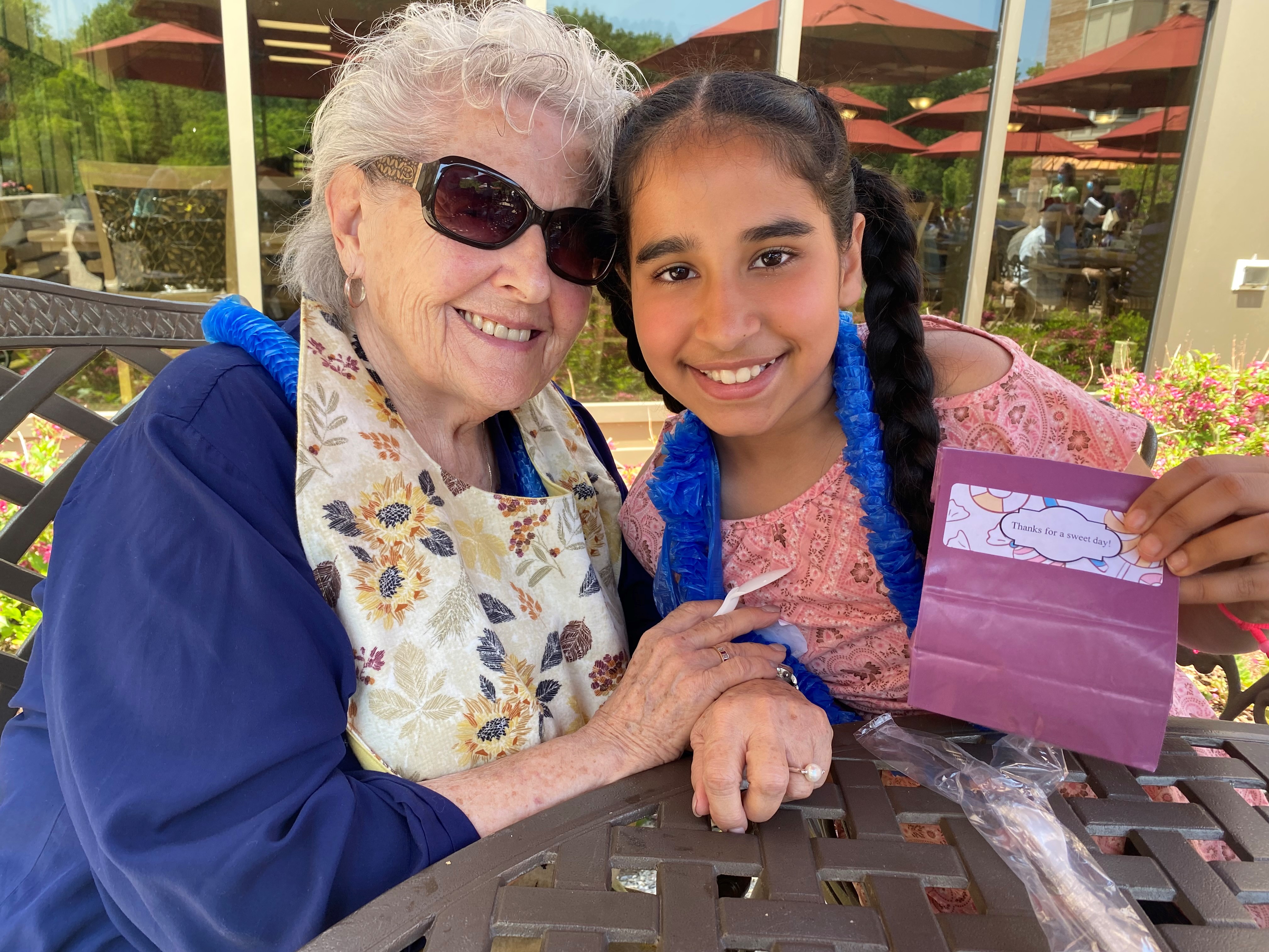 A resident from Tansley Woods and her young pen pal friends pose for the camera.