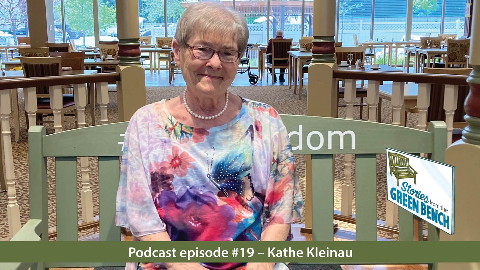 Kathe sits on the #ElderWisdom Green Bench