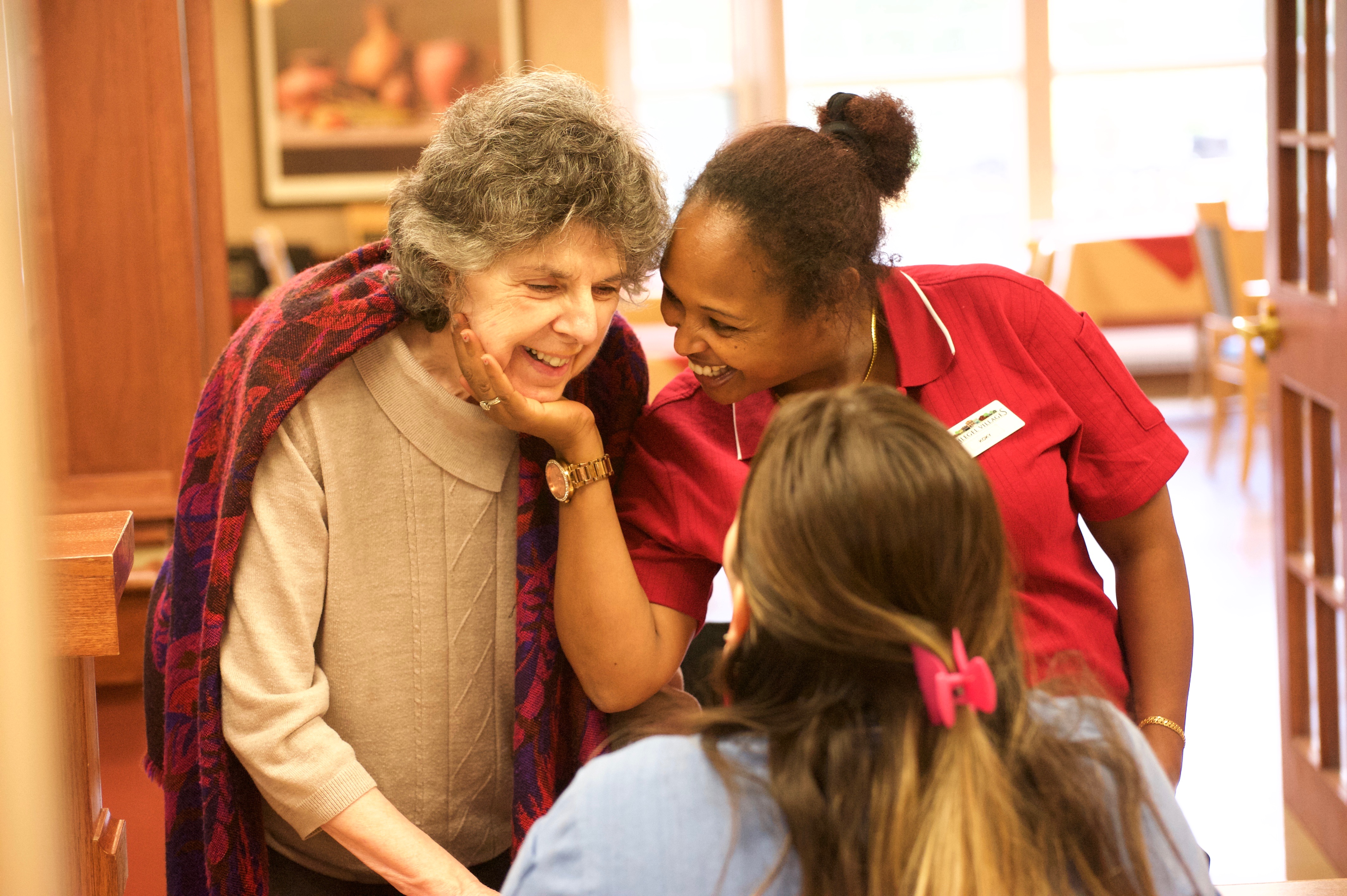 Two team members talking with a resident