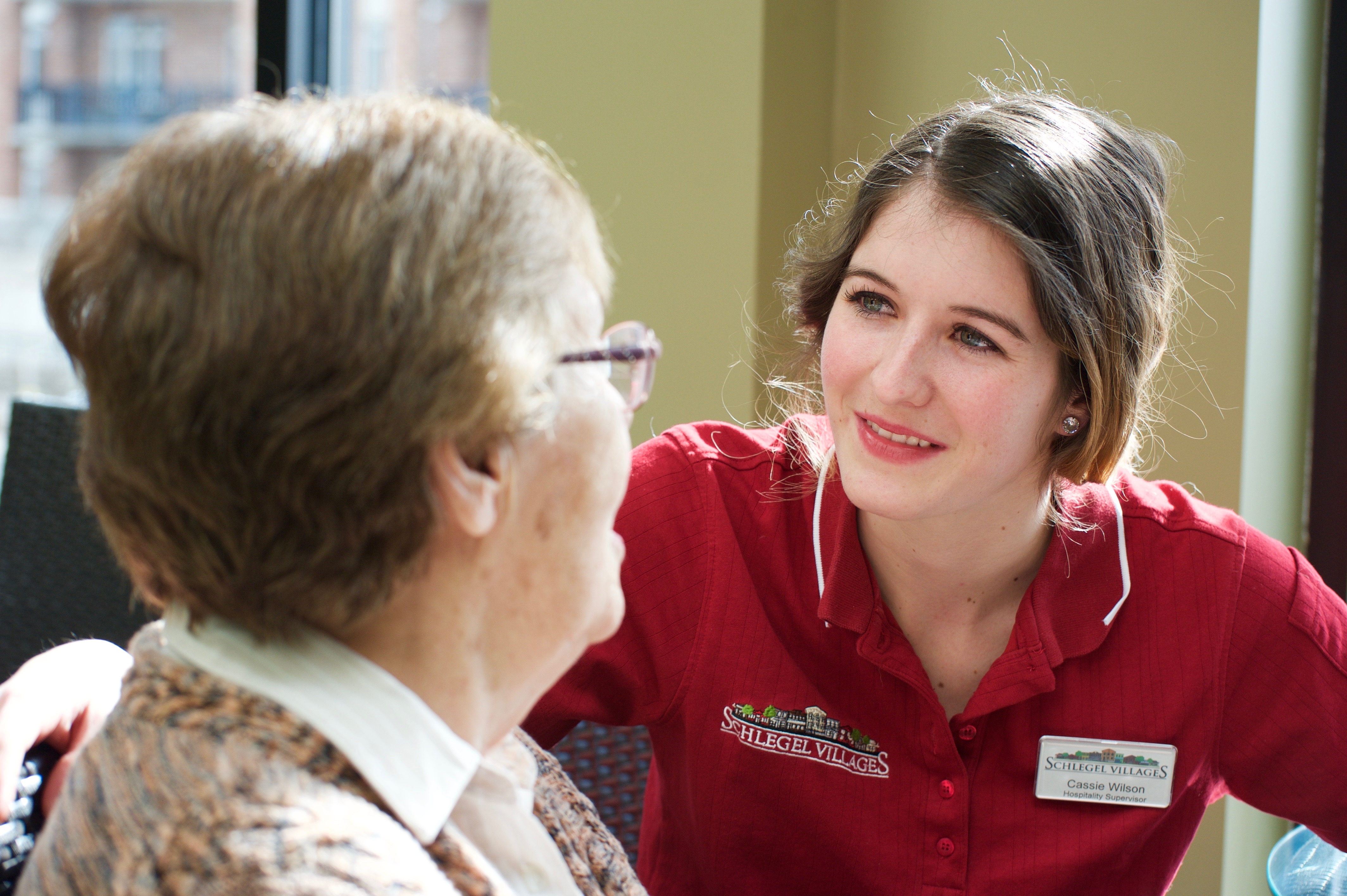 Team member taking the time to listen and connect with a resident. 