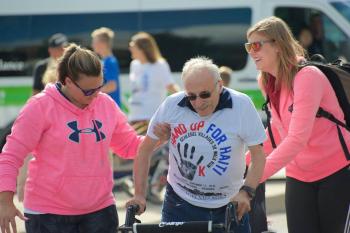 Team members assisting a resident at the Hand Up for Haiti walk